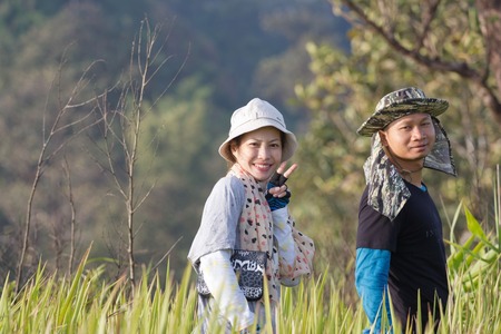 portrait of a happy tourist in a hikeの写真素材
