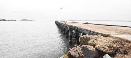 Concrete Bridge over sea water with sunrise at Sriracha Harbour Port of Thailandの写真素材