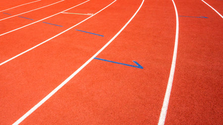 red running track on athletic stadium background texture