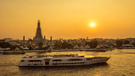 beautiful sunset wat arun temple  and river cruise on chao phraya river, landscape Bangkok Thailandの写真素材