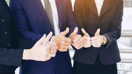 Team business partners giving Thumb up ,Successful teamwork partnership , business conceptの写真素材