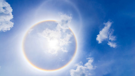 sun corona rainbow clouds and blue sky background , Circumscribed haloの写真素材