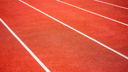 red running track on athletic stadium