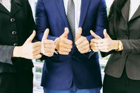 Team business partners giving Thumb up Successful teamwork partnership , business conceptの写真素材