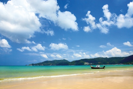 Sea view of Patong beach. A boat on Patong beach.の写真素材