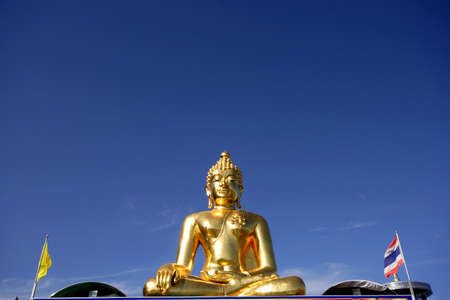 Big golden buddha with blue sky, Chiangrai province, Thailand の写真素材