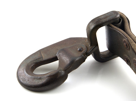 Close up of a textile belt with snap-hook isolated on whiteの写真素材