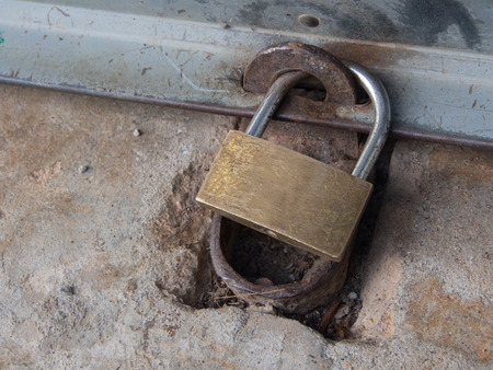 Old rusted garage padlockの写真素材