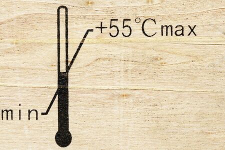 Black fragile symbol on wood , temperature