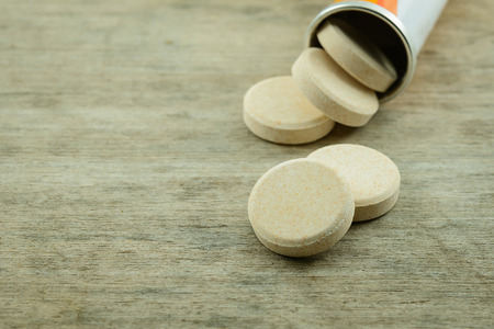 pills on wood tableの写真素材