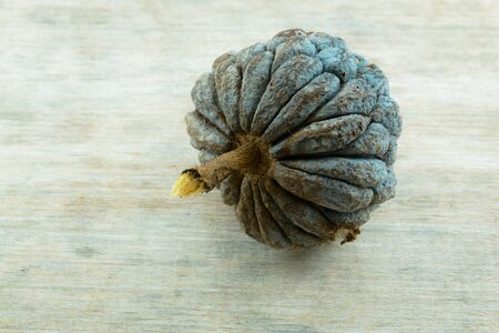Close-up Ripe sugar apple (Annona squamosa) on wooden table background.の写真素材