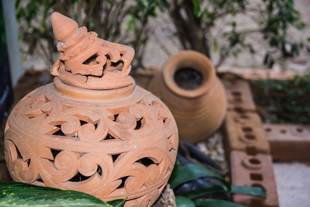 Carved beautiful pottery decoration in the garden の写真素材