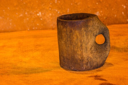 Bamboo cup on the wooden table whit bround background の写真素材