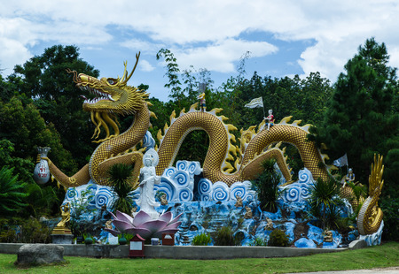 Colorful dragon statue with blue sky at public park, Thailand の写真素材