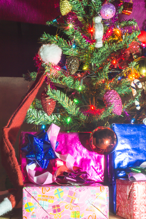 Beautifully decorated Christmas tree with many presents under it.の写真素材