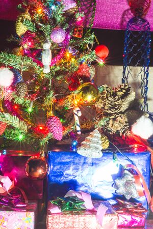 Beautifully decorated Christmas tree with many presents under it.の写真素材