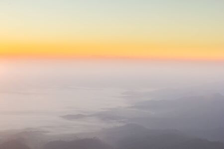 Sky gradient from blue to orange sunsetの写真素材