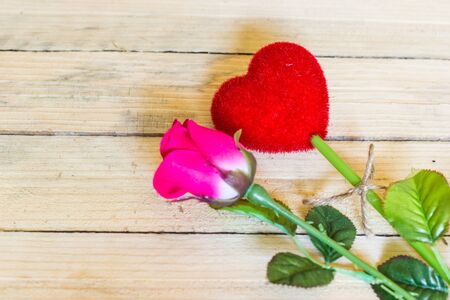 Roses and heart on wood.の写真素材