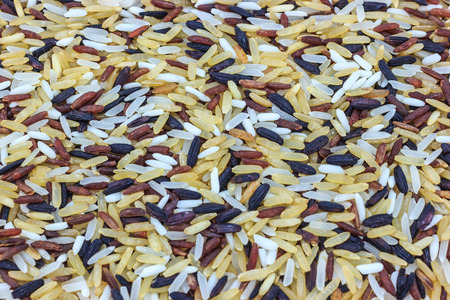 ood background with of five rice variety . rice mixture. brown rice black rice white rice yellow...