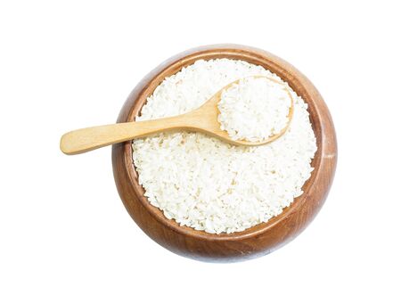 White rice on wooden spoon isolated on background. Product of Thailand, Asia.の写真素材
