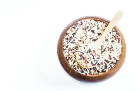 Mix rice on wooden spoon isolated on background. Product of Thailand, Asia.の写真素材