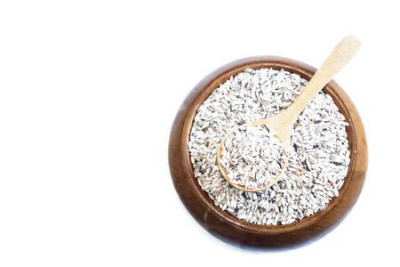 Rice on wooden spoon on wooden white  background. Product of Thailand, Asia.の写真素材