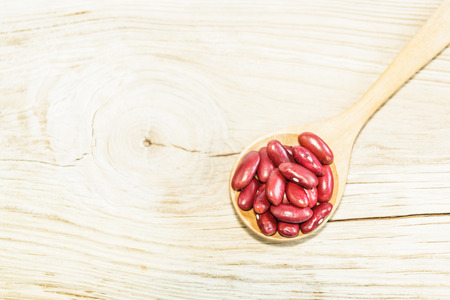 Red adzuki bean on wooden spoon