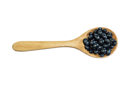 Black adzuki bean on wooden spoon in wooden bowl isolate on background. Product of Thailand, Asia.の写真素材