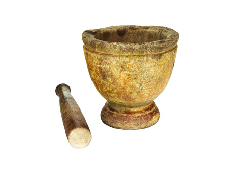 Wooden mortar and pestle on isolated white backgroundの写真素材