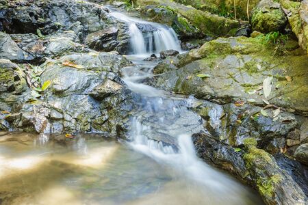 Close up nice waterfall in sunny dayの写真素材