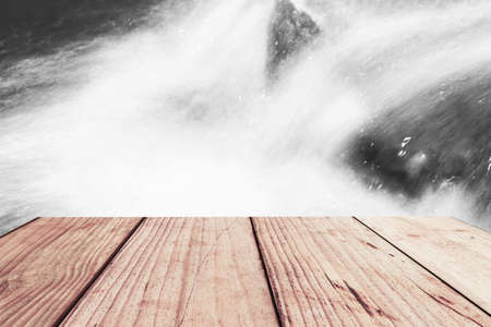 close-up beautiful waterfall in deep forest and wood pier at Chiang Mai, Thailandの写真素材