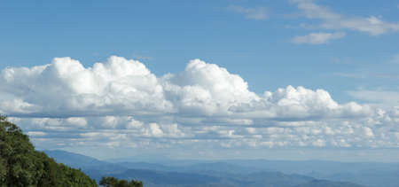 Blue sky with cloudsの写真素材