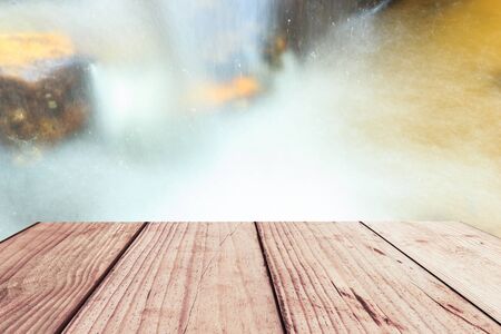 close-up beautiful waterfall in deep forest and wood pier at Chiang Mai, Thailandの写真素材