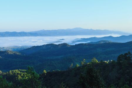 misty morning sunrise in mountain in Wiang Haeng ,chiang Mai , Thailand.の写真素材