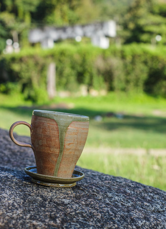 cup of morning coffee on natural outside background.の写真素材