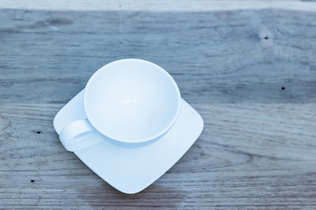 Empty tea cup on wooden tableの写真素材