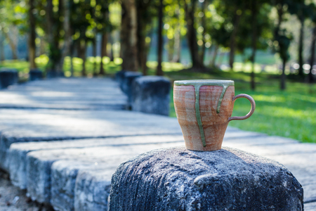 Cup of coffee in morning over mountain.の写真素材