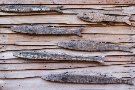The wall covered with fish wooden - wooden background horizontal.の写真素材