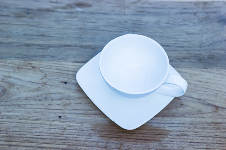 Empty tea cup on wooden tableの写真素材