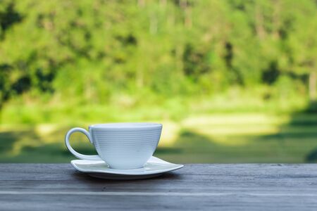 cup of morning coffee on natural outside background.の写真素材