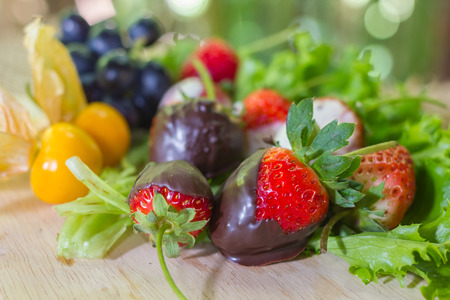 Gourmet Chocolate Covered Strawberries for Valentine's Day with fruit.の写真素材