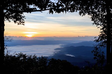 Sea of fog at dawn in the mountains north of Thailand.の写真素材