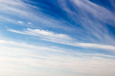 Fantastic soft white clouds against blue skyの写真素材