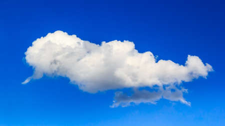 Fantastic soft white clouds against blue skyの写真素材