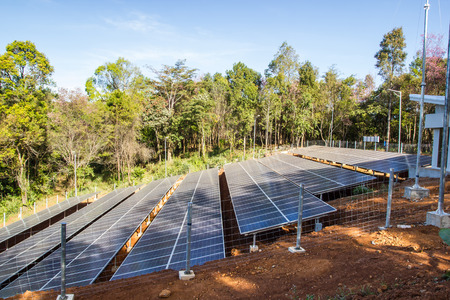 Solar Panel field in Chiang Mai, Thailand with blue sky and clouds