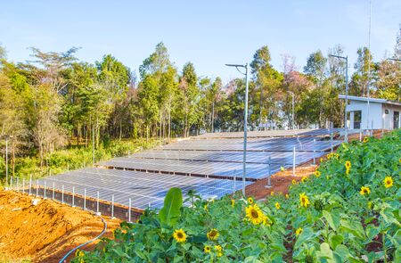 Solar Panel field in Chiang Mai, Thailand with blue sky and cloudsの写真素材