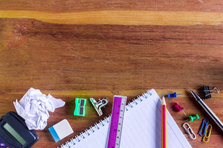 School or Office Supplies on Top of Wooden Table. Captured at bottom Border Frame with Copy Space on the above Side.の写真素材