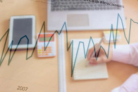 blurred office background , office worker at the computer, working dayの写真素材