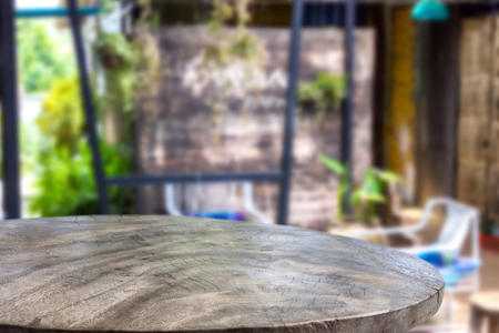 Empty wood table and blurred garden coffee light background. product display template.Business presentationの写真素材