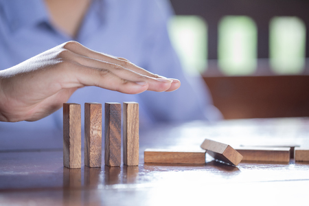 Protecting Assets From Domino Effect. Stop Loss Concept For Stock Exchange Market.の写真素材
